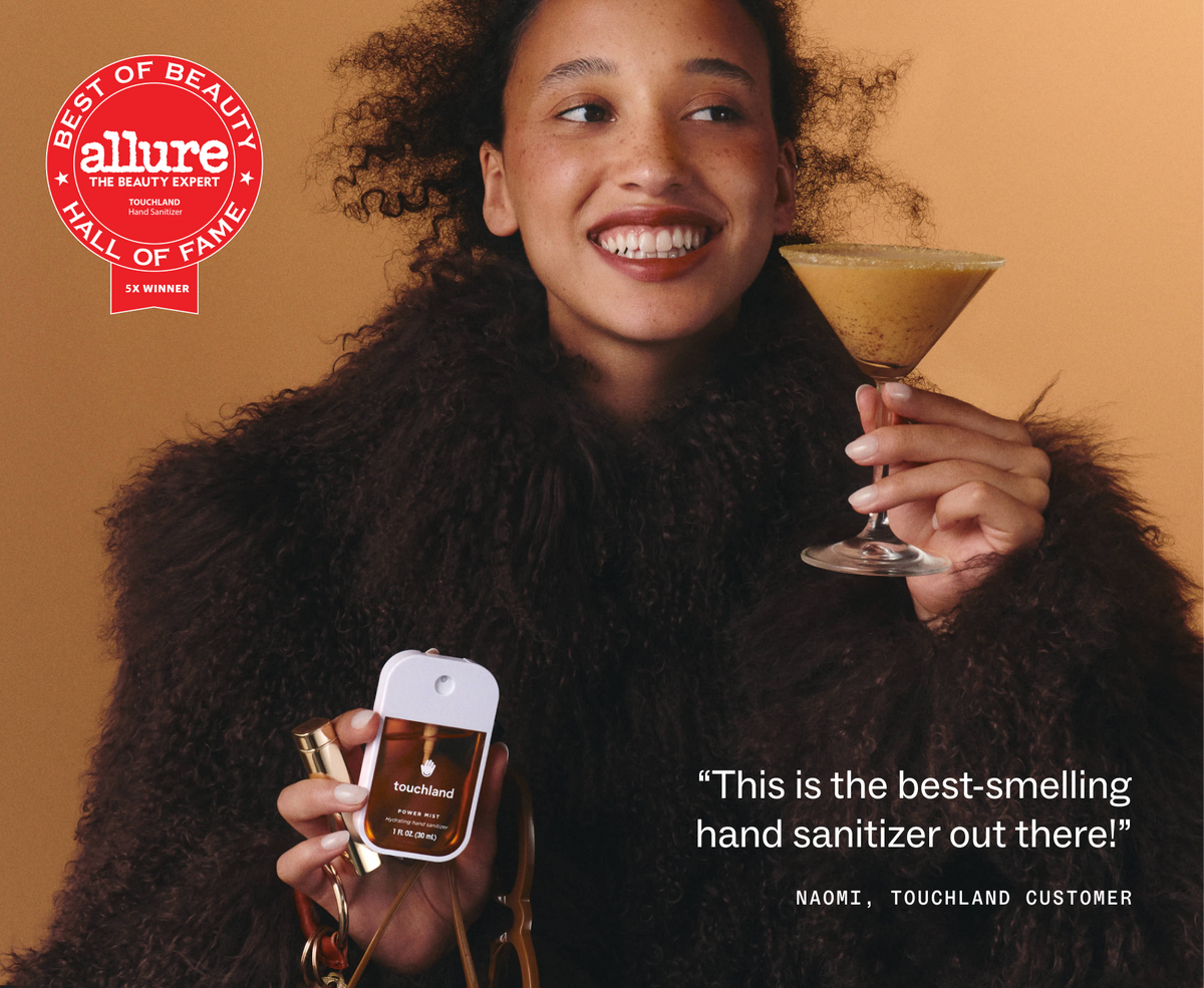 Model with a martini holding Touchland Spiced Pumpkin-Tini, Allure Best of Beauty badge
