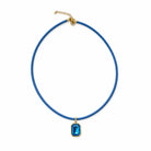 Quin Pendant Necklace in blue cord with blue jewel pendant on a white background
