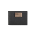 A black leather bifold wallet featuring a rectangular tan leather patch with an embossed American flag design, shown against a plain white background.