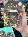 Fahlo Wander sloth tracking bracelet, shown in one of two available colors