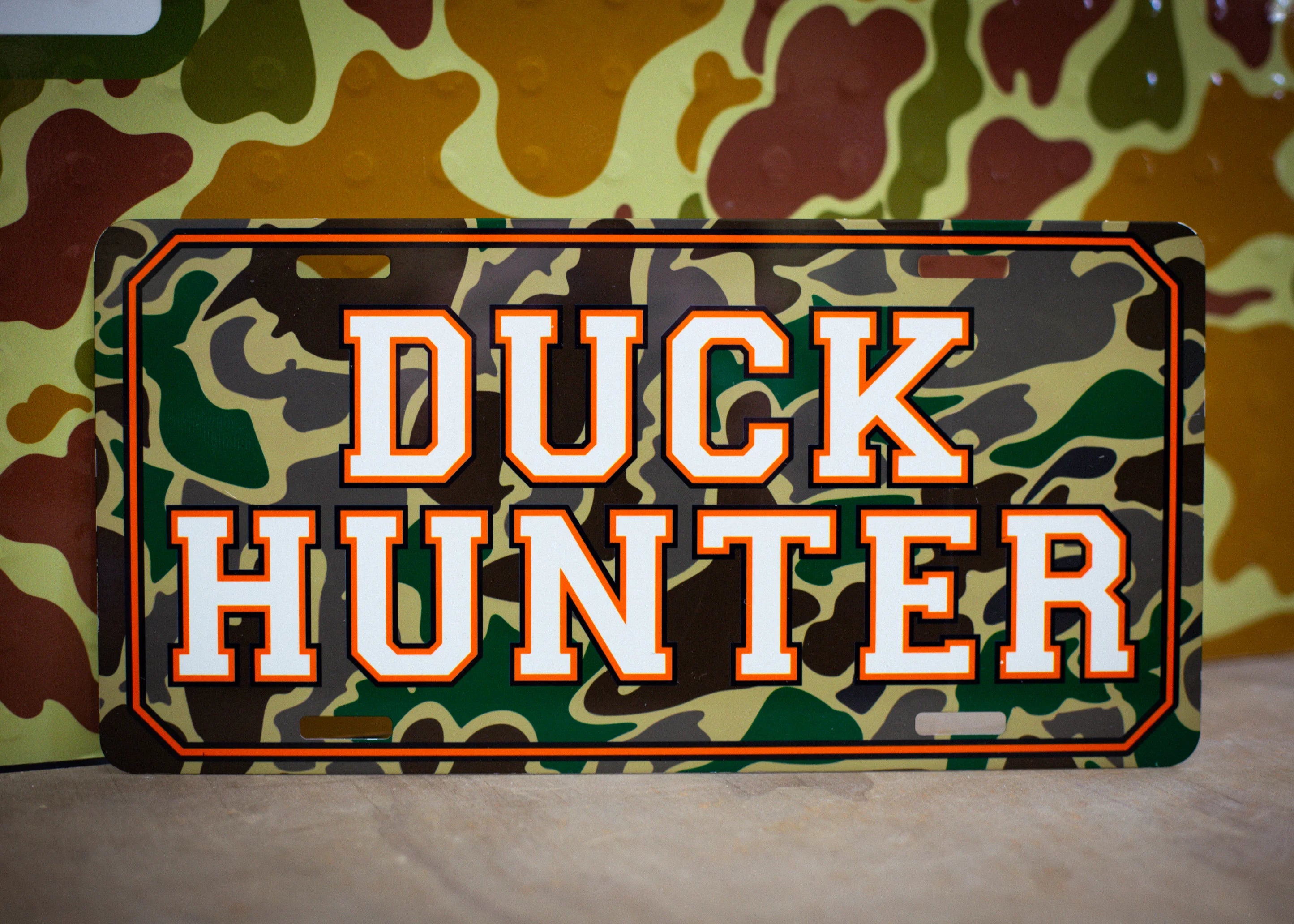 Decorative license plates in camo turkey, farm, and patriotic novelty designs