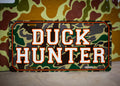 Decorative license plates in camo turkey, farm, and patriotic novelty designs