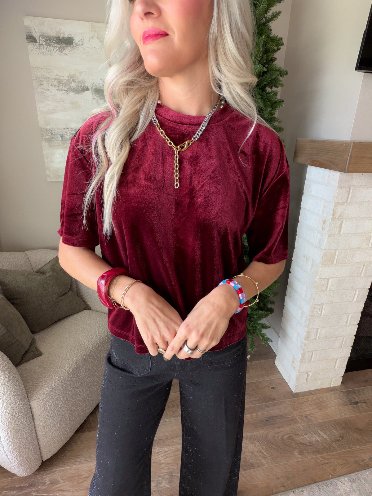 Close-up of the Dear John Maddox Toasted Currant velvet tee showing the crew neckline and rich velvet texture.