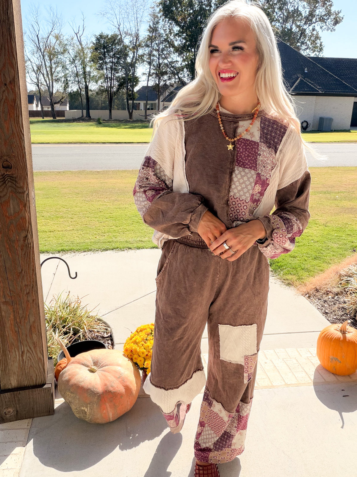 Closer front view of chocolate patchwork pants with cream thigh panel, styled with the coordinating sweatshirt.