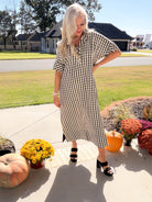 Side Notes black-and-white gingham midi dress with short sleeves and side slits, styled with black block heels.