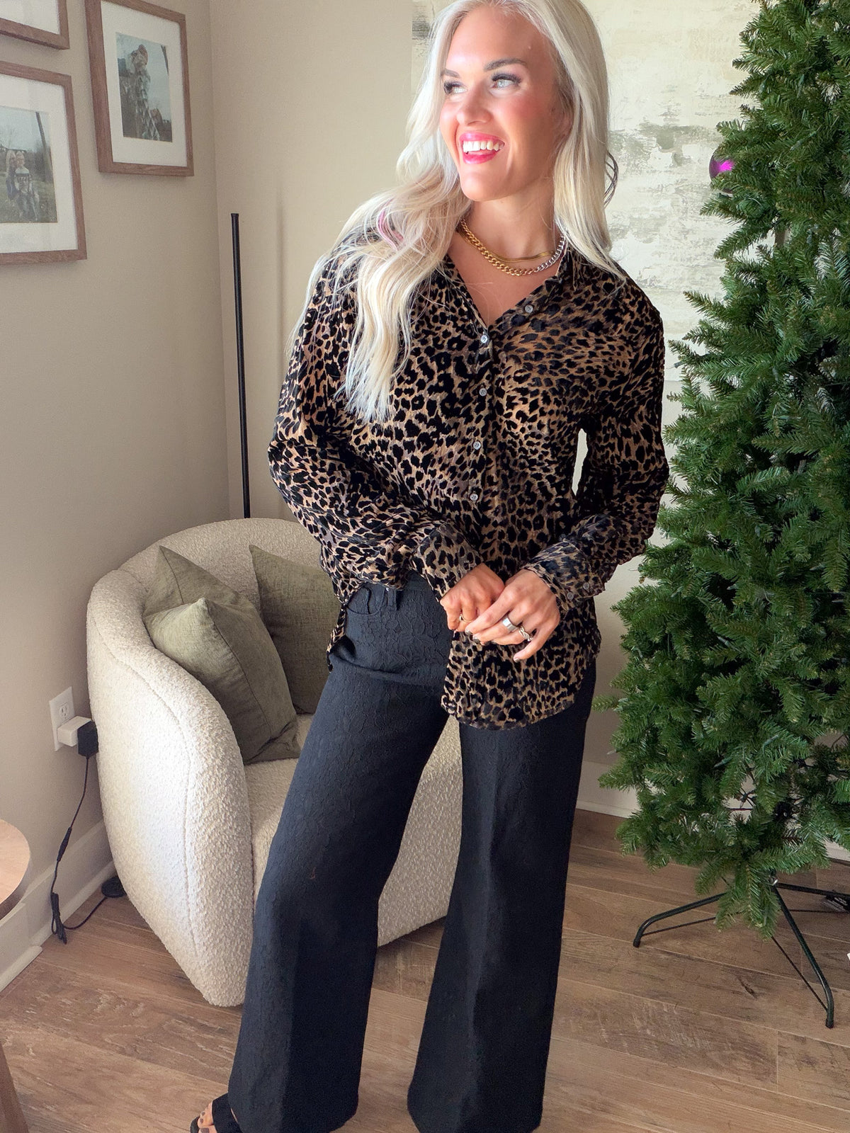 Dear John women's leopard print blouse with a partial front tuck, showing the collar and button-front design.