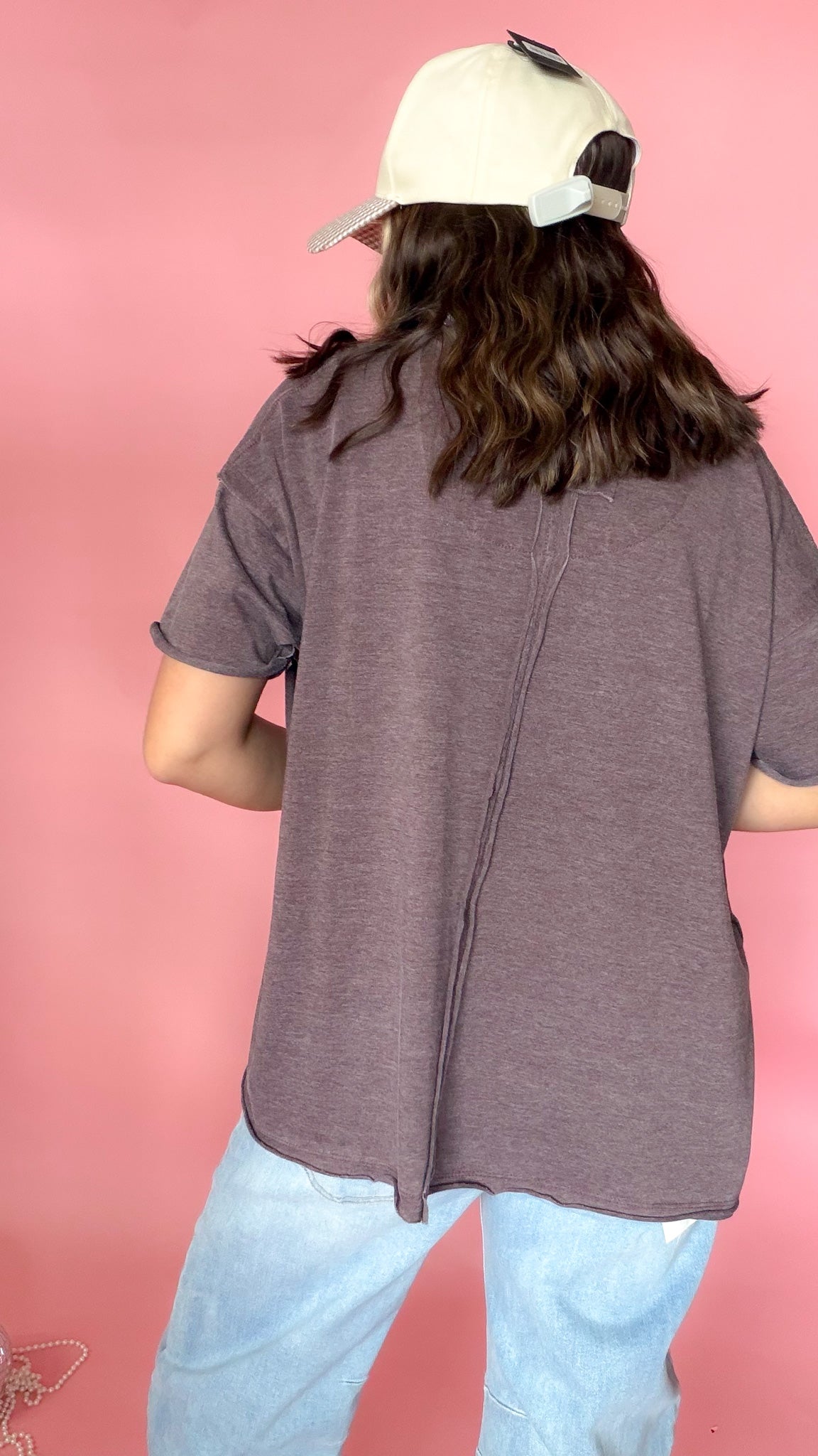 Purple and green raw edge vintage tees shown together