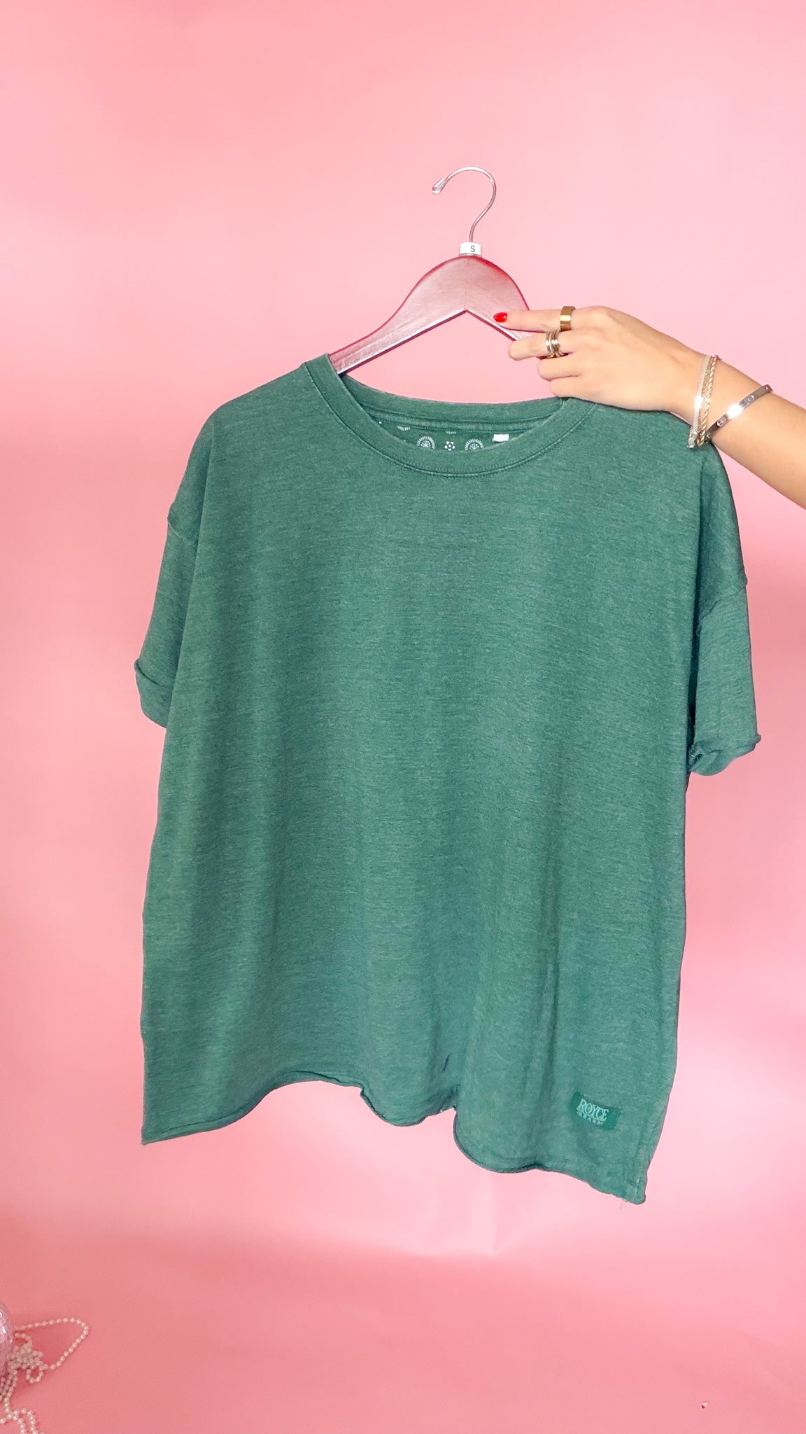 Purple and green raw edge vintage tees shown together