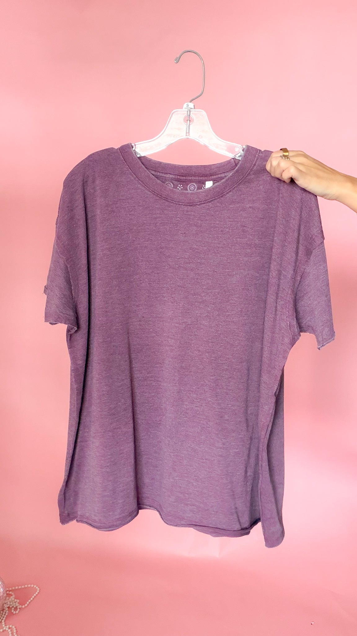 Purple and green raw edge vintage tees shown together