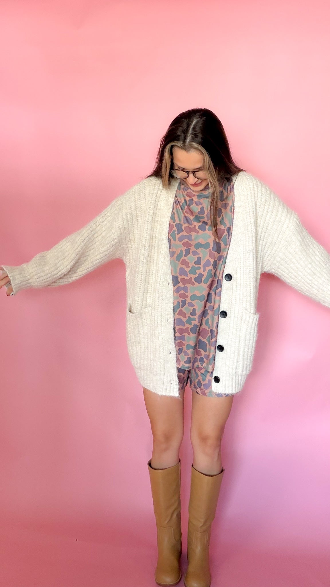 Oversized oatmeal chunky knit cardigan, button front, worn open over a graphic tee