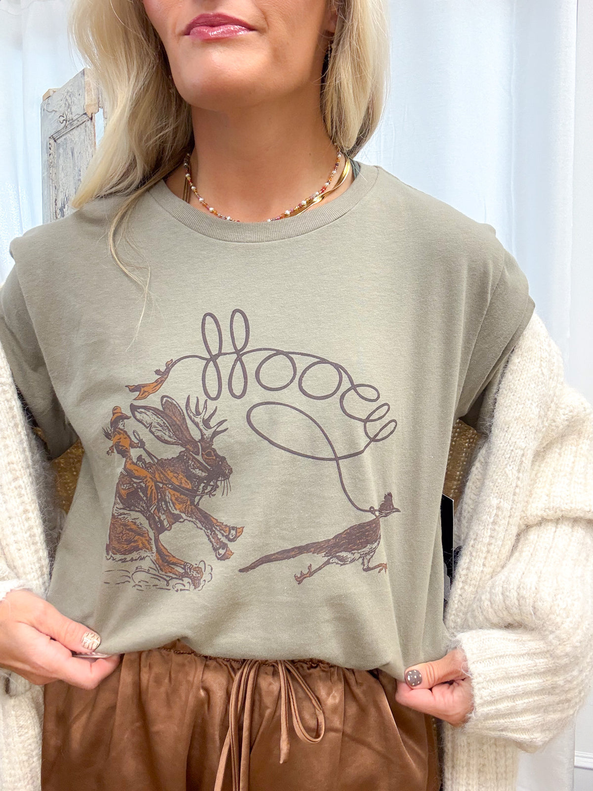 Olive green graphic tee with 'Jackie' design