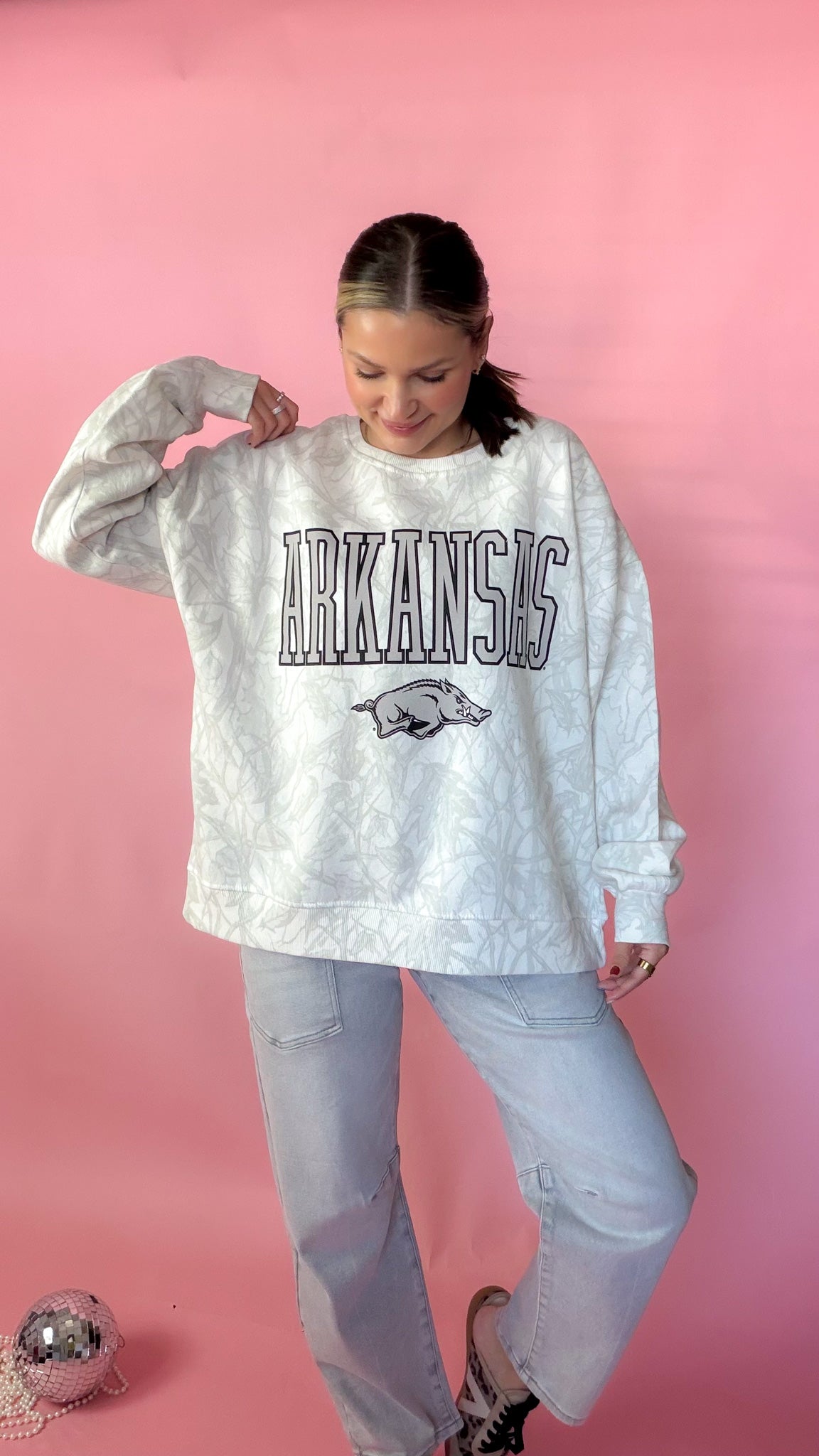 HK wearing the white camo arkansas razorback sweatshirt