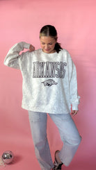 HK wearing the white camo arkansas razorback sweatshirt