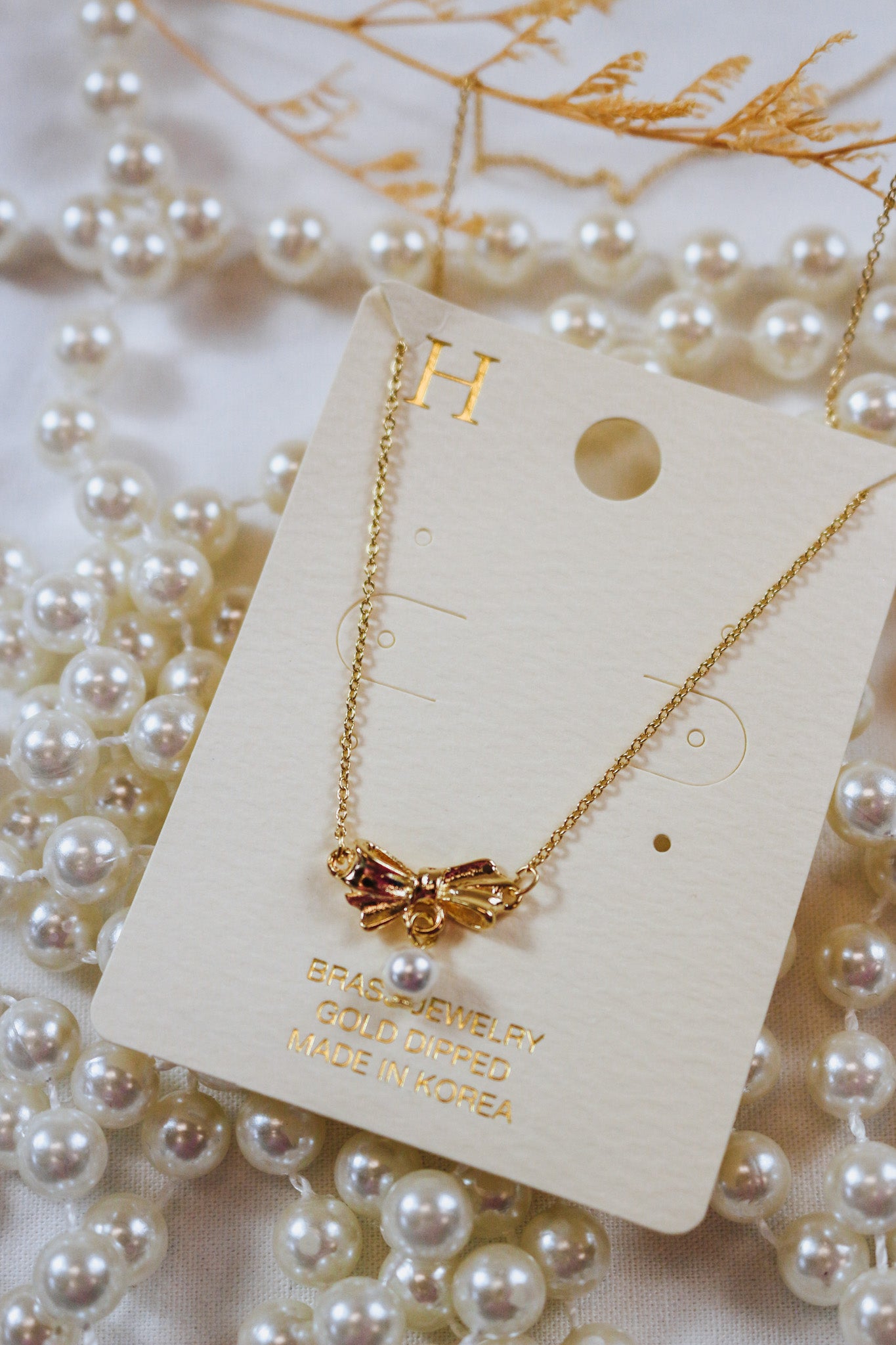 Gold Bow Pearl Necklace