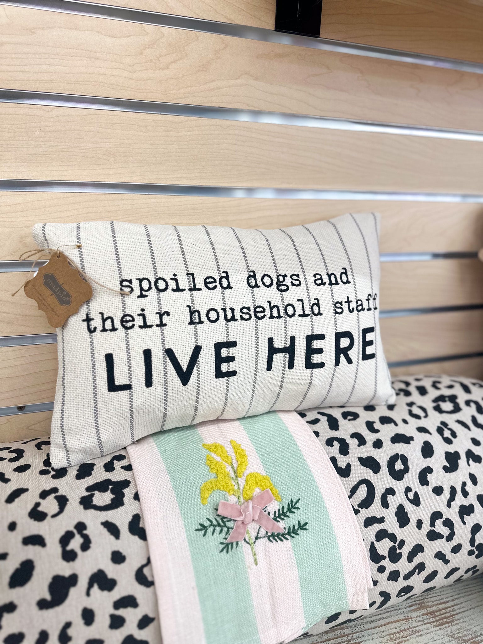 Dog striped throw pillow, shown in one of three available colors