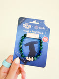 Fahlo Voyage Hammerhead Shark Tracking Bracelet in green beads with shark charm, on its card