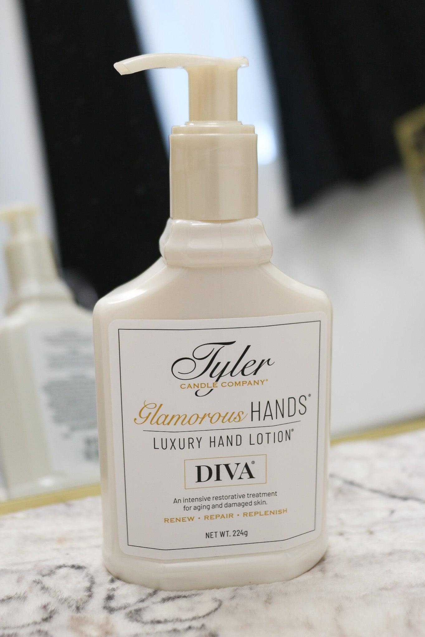 Tyler Luxury hand lotion 8oz, shown in one of two available scents