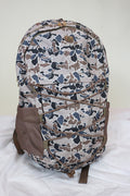 Simply Southern backpacks shown in camo, black, floral, pink cherry print, snake print, and navy floral