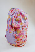 Simply Southern backpacks shown in camo, black, floral, pink cherry print, snake print, and navy floral