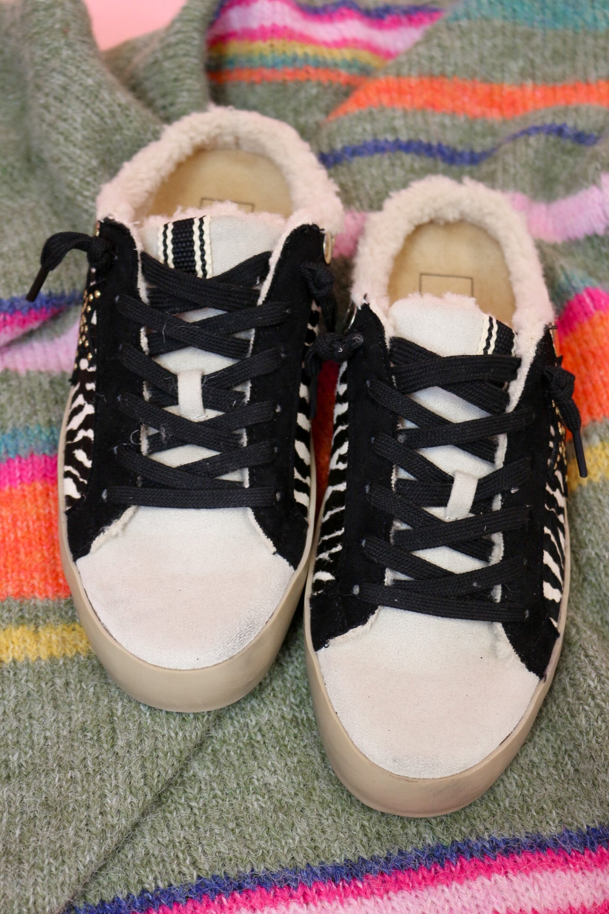 Front view of the Pippa zebra slip-on sneakers with cream toe caps