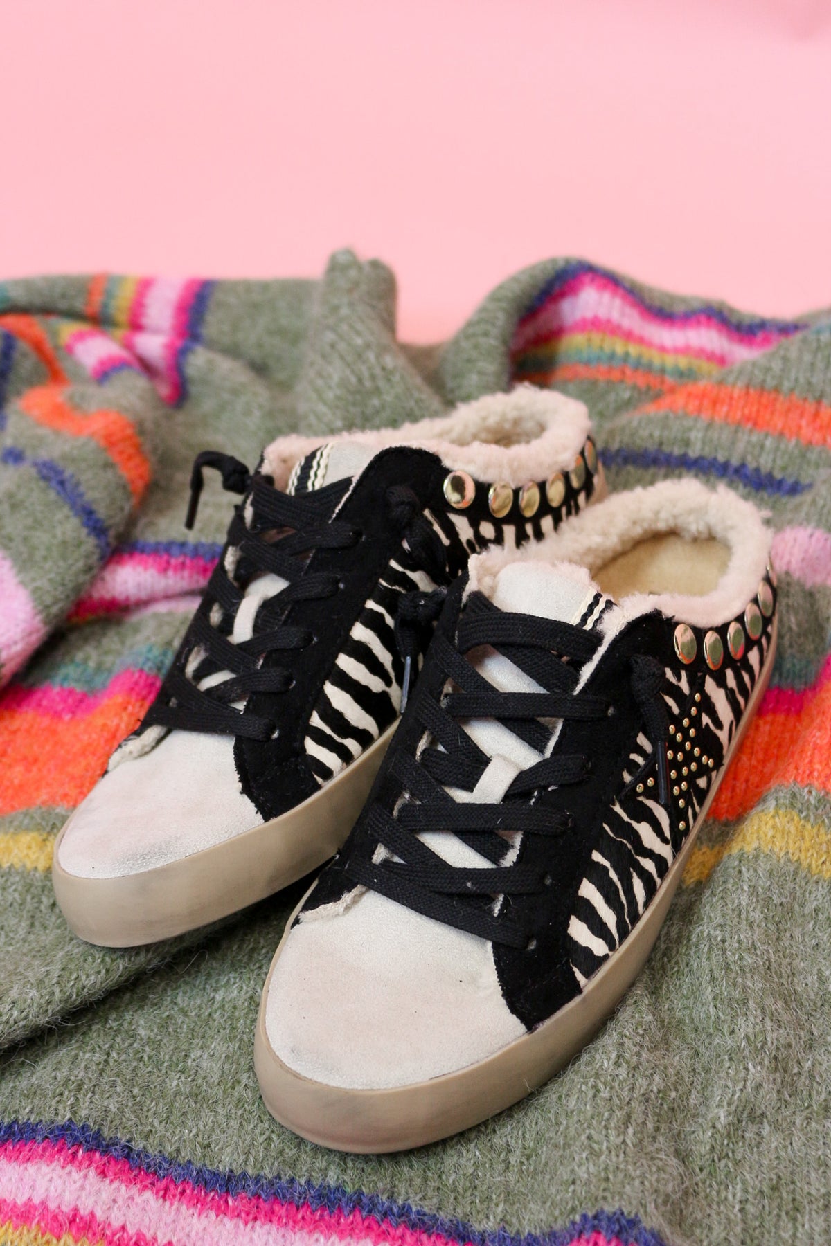 Side view of the pair of Pippa zebra print slip-on sneakers