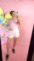 Lulu Mac white logo patch tank top, shown in one of three available colors