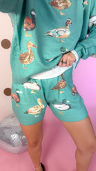 Mallard sea green set, close-up of duck print shorts and sweater hem