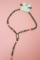 Silver-tone and pink beaded necklace with a rectangular centerpiece and long Y-shaped drop, shown with matching earrings.