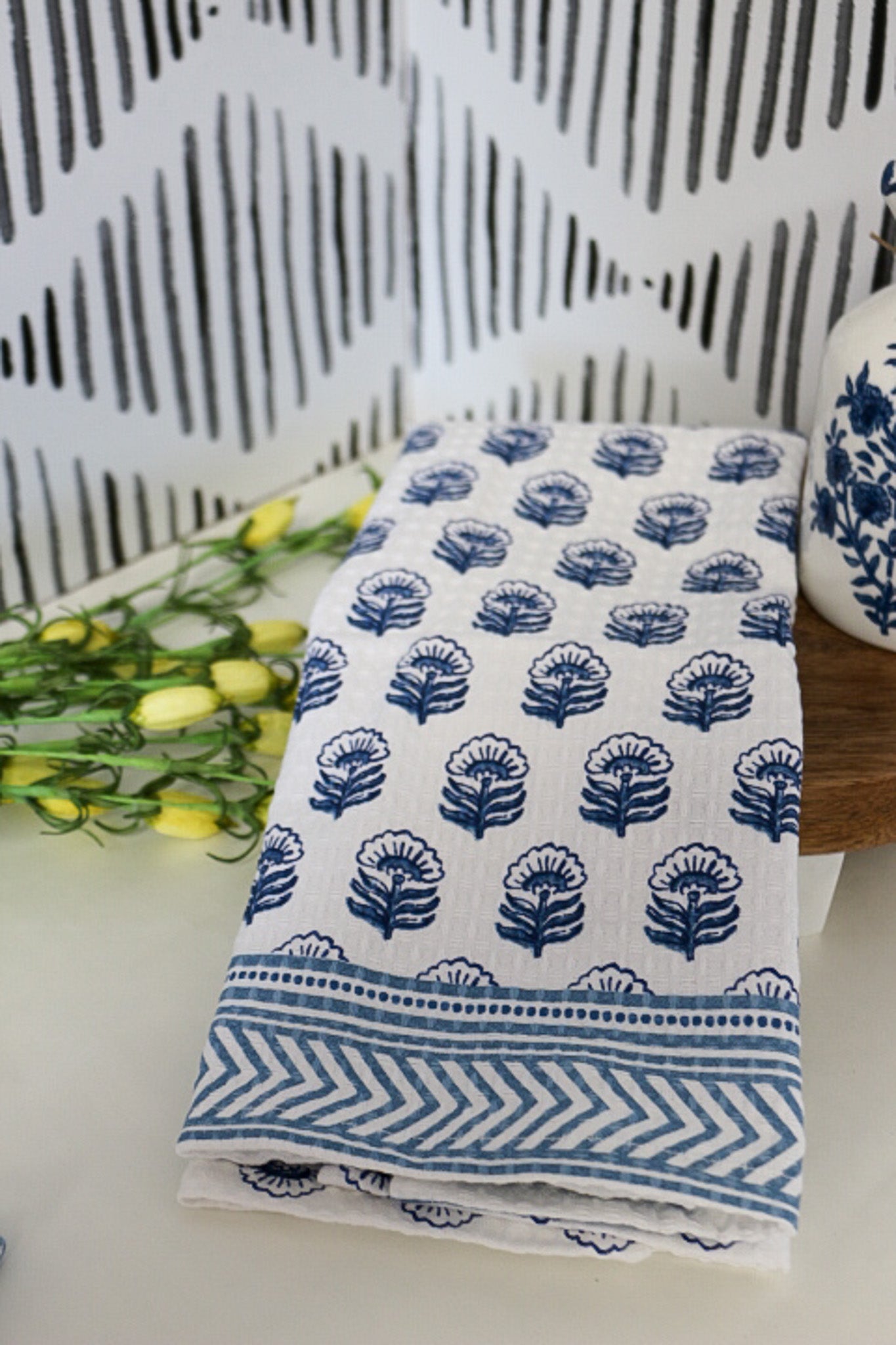Blue floral print edge towel, shown in one of four available colors