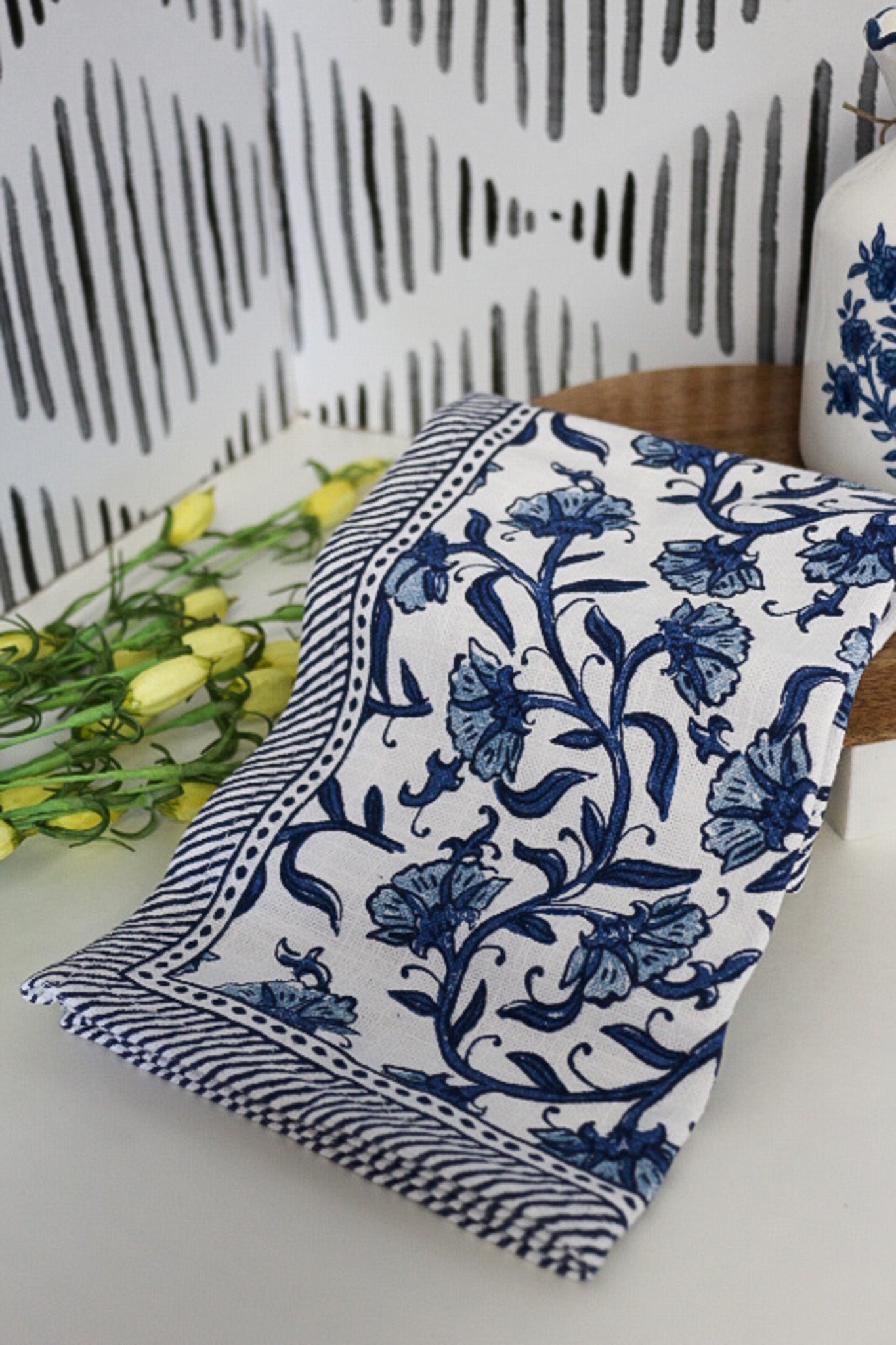 Blue floral print edge towel, shown in one of four available colors