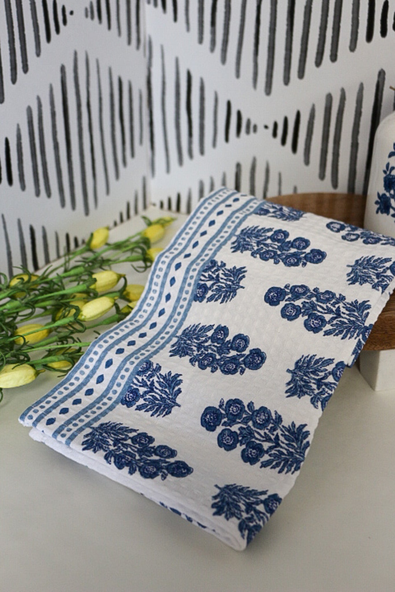 Blue floral print edge towel, shown in one of four available colors