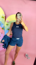 Lulu Mac white logo patch tank top, shown in one of three available colors