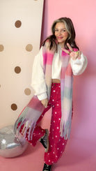 Joia plaid pink chunky scarf, model giving peace sign