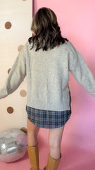A Warming Welcome sweater, back view on model