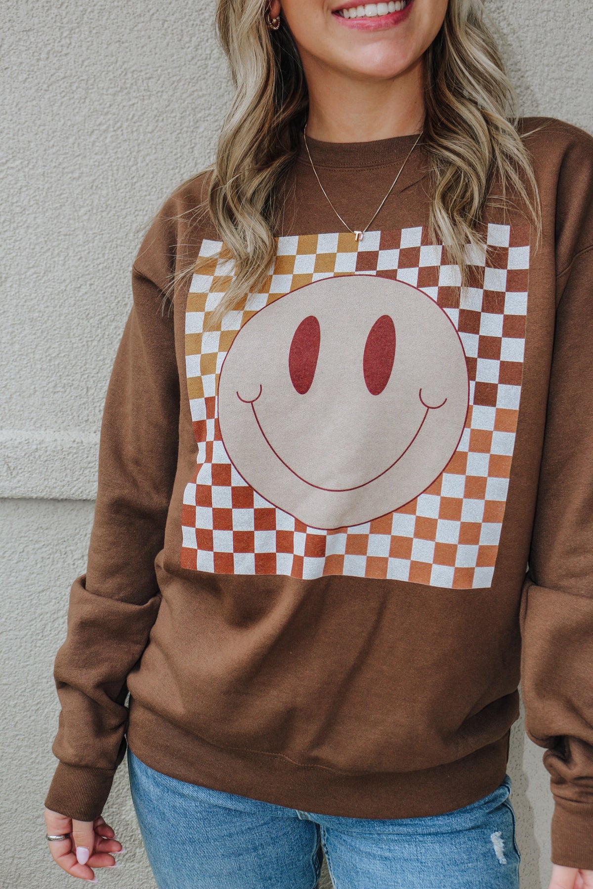 brown smiley face sweatshirt