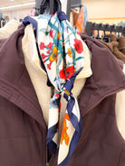 Large floral print bandana scarf, close-up of red poppy print over vest