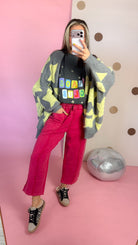 Full-length mirror view of Red mineral wash barrel pants styled with a gray star cardigan and sneakers.