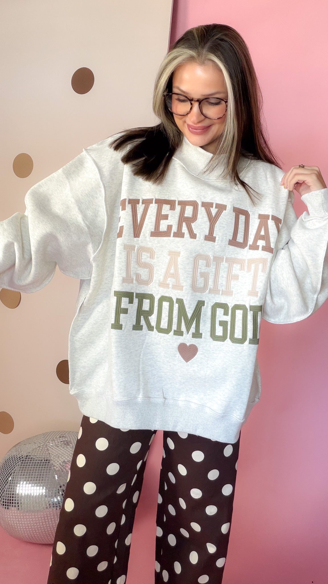 Close front view of ash grey Christian sweatshirt showing multicolor Every Day Is A Gift From God embroidery