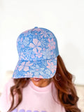 Birdie trucker hat in blue and pink, shown in one of two available colors