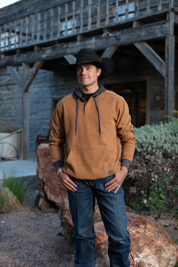 Hooey Men's Cowboy Corduroy Hoodie in brown, worn outdoors with a cowboy hat and jeans
