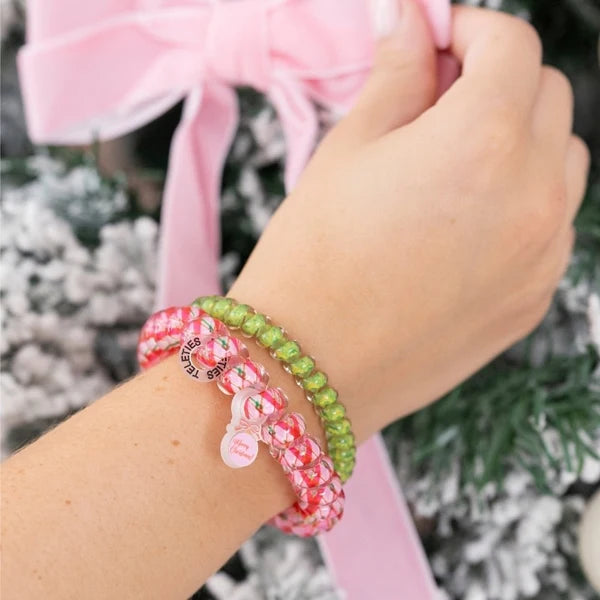Teleties And To All A Good Night spiral hair ties worn as bracelets on a wrist
