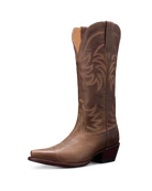 Brown cowboy boot with intricate design on a white background. Tecovas women’s cowboy boots