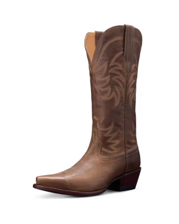 Brown cowboy boot with intricate design on a white background. Tecovas women’s cowboy boots