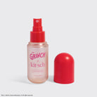The Grinch x Kitsch Cherry Cheer hair perfume with cap off showing the spray nozzle