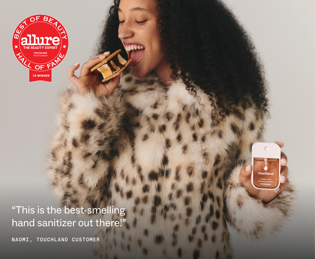Model in leopard coat holding Touchland Midnight S'mores with Allure Best of Beauty badge