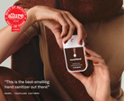 Hand holding Touchland Salted Caramel Power Mist with Allure Best of Beauty badge