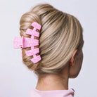 Teleties Breast Cancer Awareness large claw clip holding a twisted updo