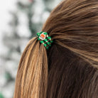 Teleties Clause I Said So green Santa hair tie holding a ponytail