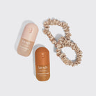 Kitsch Sweet and Silky set, Warm Sugar and Caramel Cream mists with two satin scrunchies laid flat
