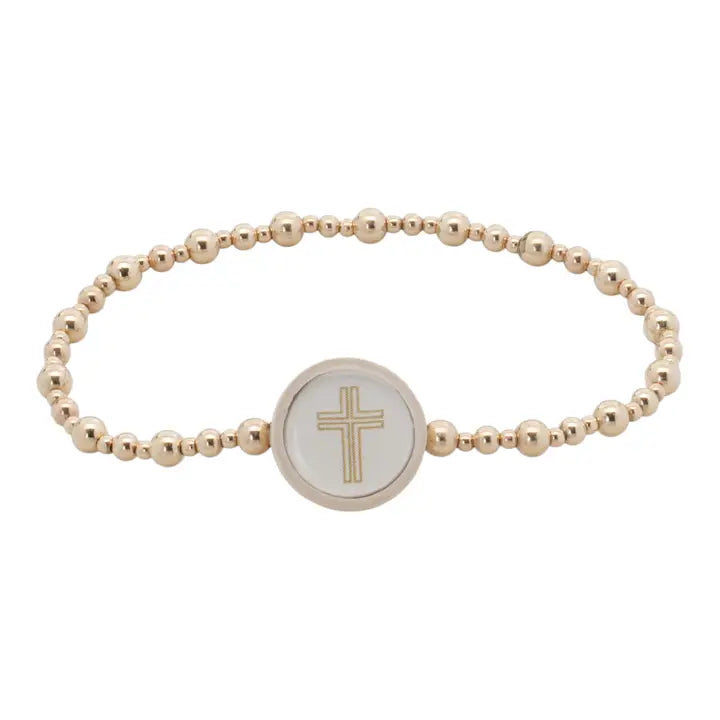 Majesty Tap To Pray bracelet with gold-tone beads in varied sizes and a pale round cross centerpiece on white.